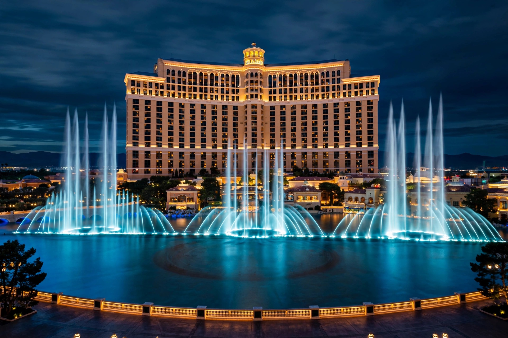 Illuminated fountains and grand Mediterranean facade of Bellagio resort